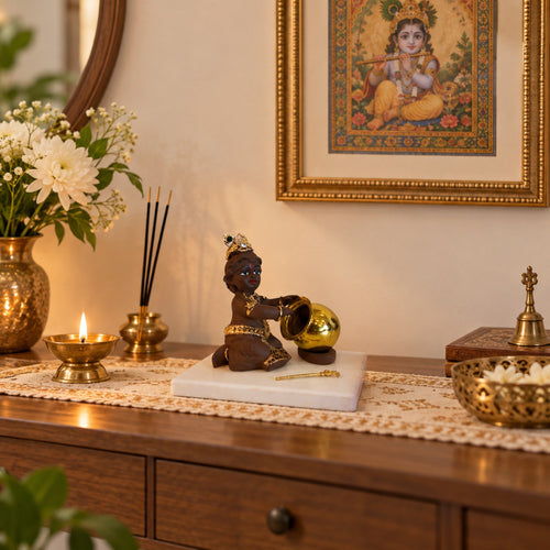 Baby Krishna Brown Figurine with Butter Pot displayed in a home setting