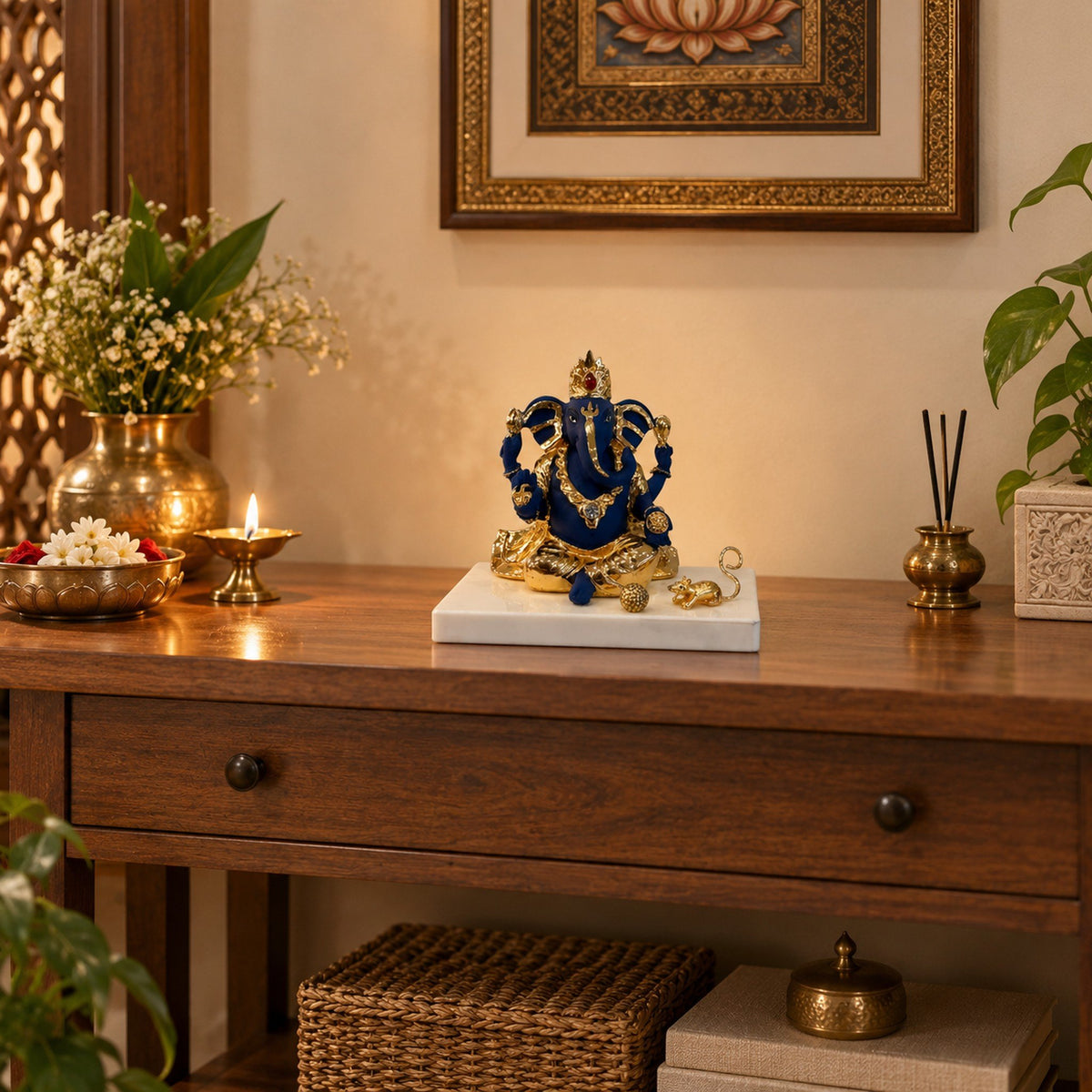 Blue and Gold Ganesh Idol on Marble-Look Base displayed in a home setting